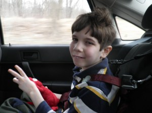 Jonah, holding Fearless Fred & telling me "three" with his fingers 