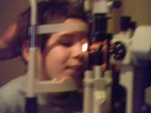 He even smiled as she guided his head into the eye machine