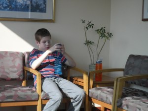 Boo playing nicely with the slinky I'd brought him...sitting in the waiting room patiently for doctor number two, this time planned.  He was a good boy the whole time.