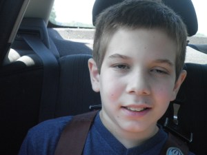 he's starting to feel a little icky here but still has a smile for mama