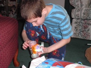 Jonah Boo, playing on my mom's floor with a flashing turnabout radio-controlled car