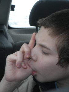 Jonah invented a new suck-your-thumb-while-giving-a-gang-signal, supercool move