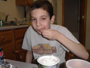 Rockin' his Almanzo Wilder Homestead shirt & eating some chips and dip...