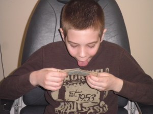 very silly boy. (no, i did not let him lick the $10 bill he's holding).  lol