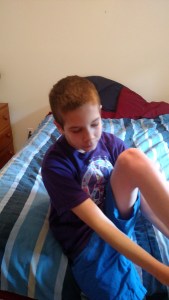 putting on his socks and shoes